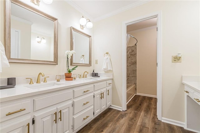 bathroom featuring a sink, tub / shower combination, double vanity, and wood finished floors