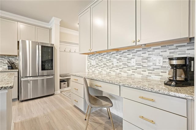 5322 Burrus Ln SW, Mableton, GA 30126 - kitchen with smart refrigerator, ornamental molding, decorative backsplash, light wood-style flooring, and light stone countertops