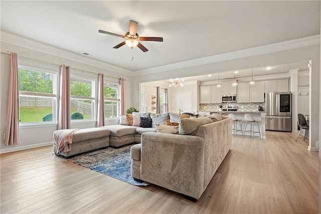 5322 Burrus Ln SW, Mableton, GA 30126 - living room with ornamental molding, a ceiling fan, light wood-style floors, and baseboards