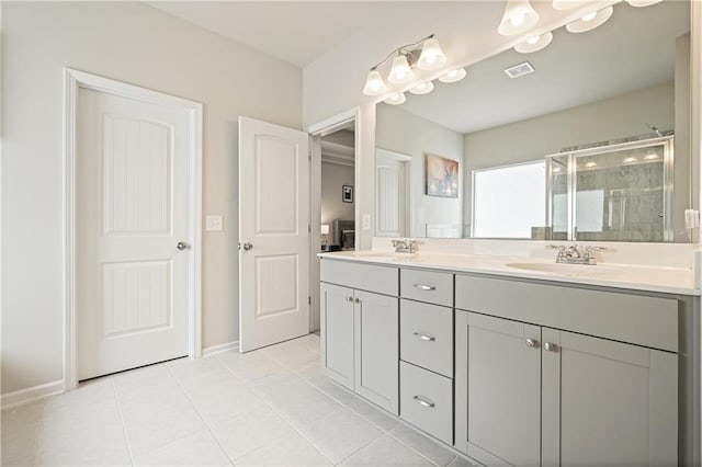 5322 Burrus Ln SW, Mableton, GA 30126 - bathroom with a stall shower, tile patterned flooring, double vanity, and baseboards