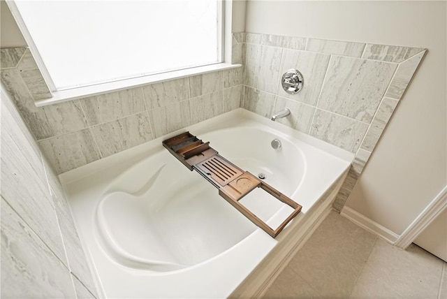 5322 Burrus Ln SW, Mableton, GA 30126 - bathroom featuring a bath and tile patterned floors