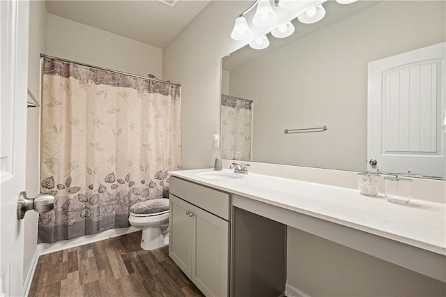 5322 Burrus Ln SW, Mableton, GA 30126 - bathroom featuring wood finished floors, toilet, and vanity