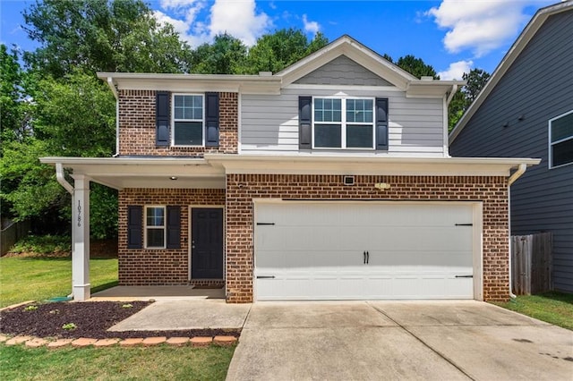 10786 Wheeler Trce, Hampton, GA 30228 - view of front facade featuring brick siding, driveway, and a garage