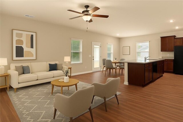 10786 Wheeler Trce, Hampton, GA 30228 - living area featuring wood finished floors, ceiling fan, recessed lighting, and baseboards