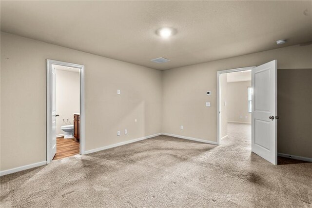 10786 Wheeler Trce, Hampton, GA 30228 - empty room featuring carpet floors, baseboards, and a smoke detector