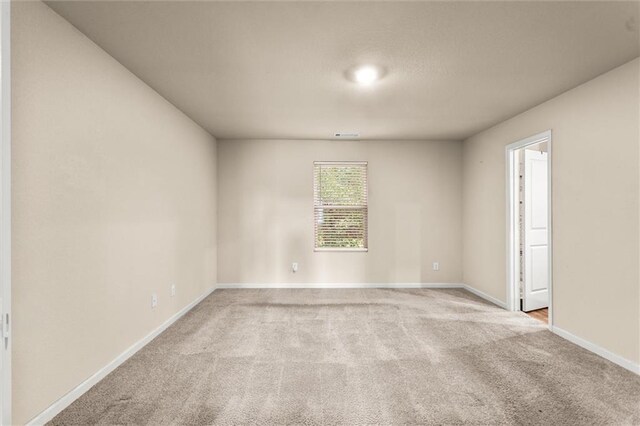10786 Wheeler Trce, Hampton, GA 30228 - spare room with light carpet and baseboards