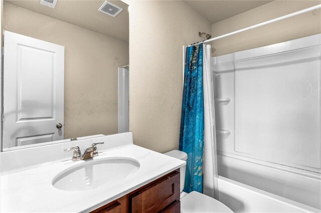 10786 Wheeler Trce, Hampton, GA 30228 - full bathroom featuring vanity, shower / bath combo, and toilet