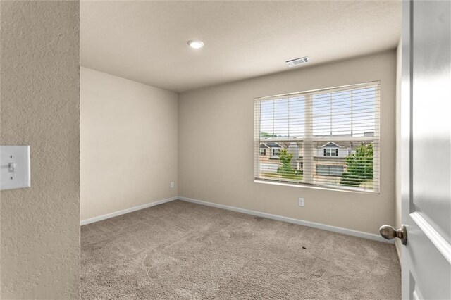 10786 Wheeler Trce, Hampton, GA 30228 - carpeted spare room featuring baseboards