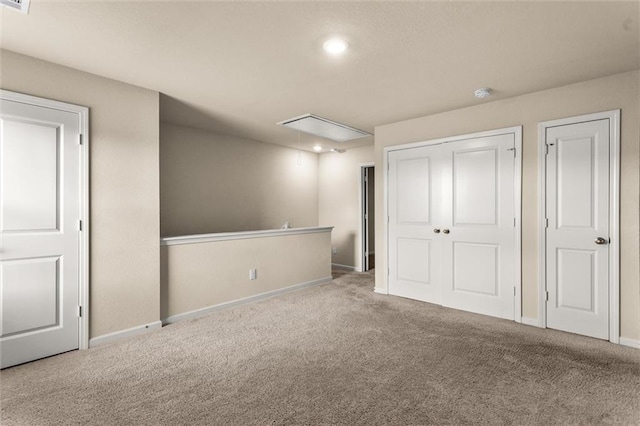 10786 Wheeler Trce, Hampton, GA 30228 - unfurnished bedroom featuring attic access, carpet flooring, baseboards, recessed lighting, and a closet