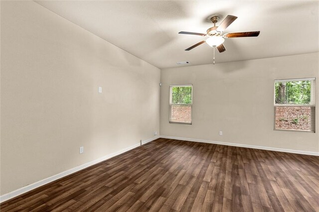 10786 Wheeler Trce, Hampton, GA 30228 - unfurnished room with baseboards, ceiling fan, and dark wood-style floors