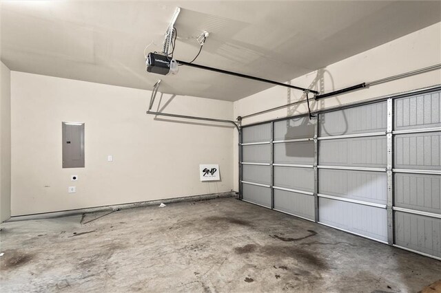 10786 Wheeler Trce, Hampton, GA 30228 - garage featuring electric panel and a garage door opener