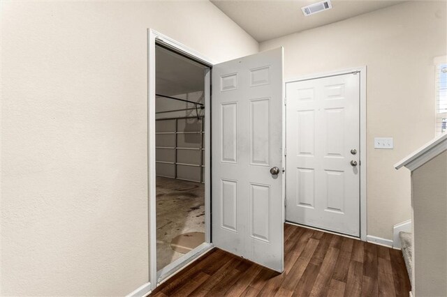 10786 Wheeler Trce, Hampton, GA 30228 - foyer with dark wood-style floors and baseboards