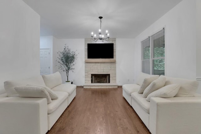 11280 Brookhollow Trl, Alpharetta, GA 30022 - living room featuring a chandelier, wood finished floors, and a stone fireplace