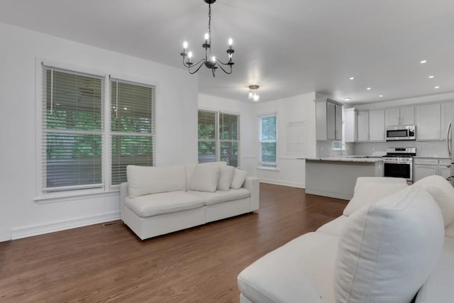 11280 Brookhollow Trl, Alpharetta, GA 30022 - living area with a chandelier, dark wood-style flooring, baseboards, and recessed lighting