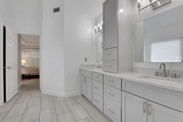 11280 Brookhollow Trl, Alpharetta, GA 30022 - ensuite bathroom with double vanity and baseboards