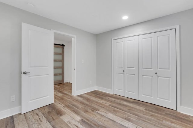 11280 Brookhollow Trl, Alpharetta, GA 30022 - unfurnished bedroom with recessed lighting, light wood-style flooring, baseboards, and a closet