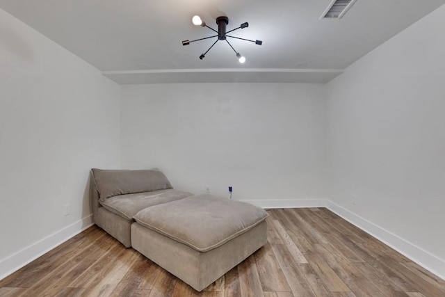 11280 Brookhollow Trl, Alpharetta, GA 30022 - sitting room with a chandelier, baseboards, and wood finished floors