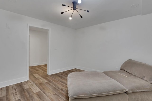 11280 Brookhollow Trl, Alpharetta, GA 30022 - sitting room with baseboards, wood finished floors, and a chandelier