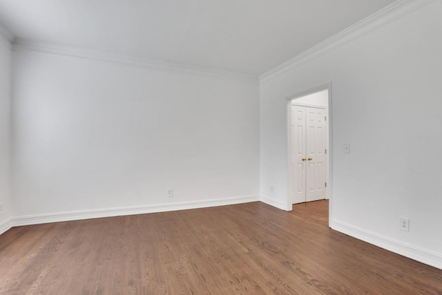 11280 Brookhollow Trl, Alpharetta, GA 30022 - spare room featuring baseboards, ornamental molding, and wood finished floors