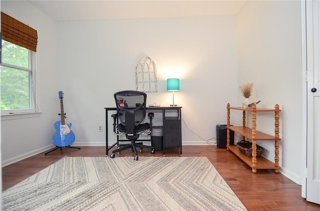 office area featuring baseboards and wood finished floors