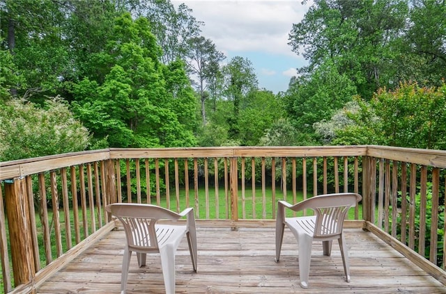 wooden deck with a yard