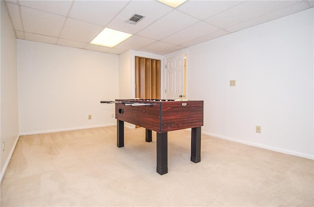 game room with baseboards, visible vents, light carpet, and a drop ceiling