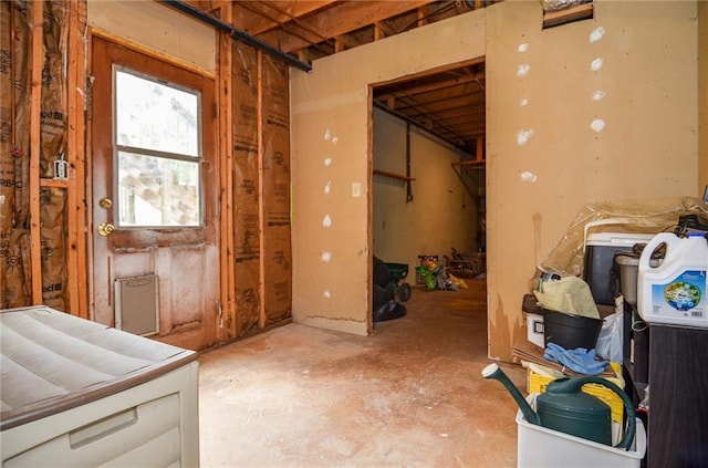 interior space featuring unfinished concrete flooring