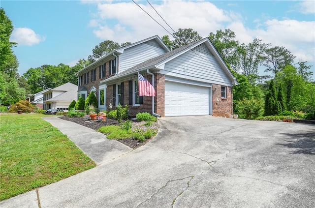 view of front of house with a garage, aphalt driveway, a front lawn, and brick siding