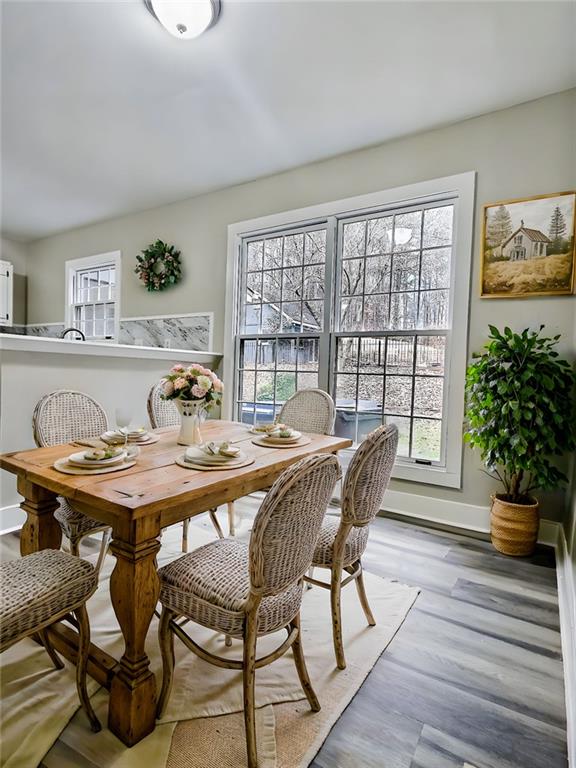 dining space with light hardwood / wood-style flooring