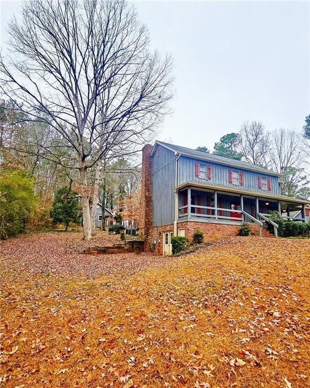 view of front of house with a sunroom