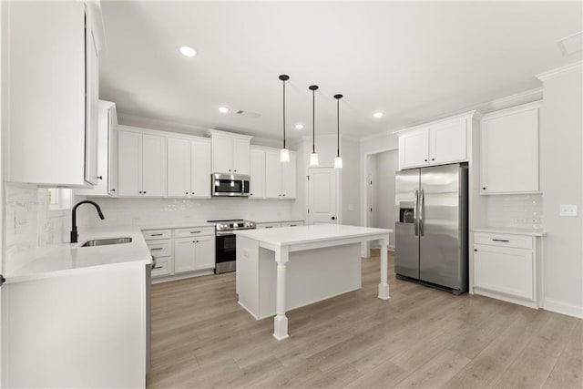 418 Brookstone Trl, Dawsonville, GA 30534 - kitchen featuring stainless steel appliances, a sink, tasteful backsplash, a center island, and white cabinets