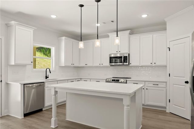 418 Brookstone Trl, Dawsonville, GA 30534 - kitchen with stainless steel appliances, a sink, white cabinetry, light countertops, and tasteful backsplash
