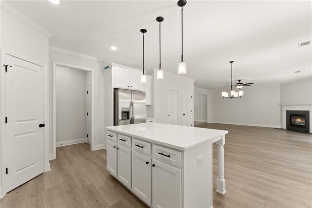 418 Brookstone Trl, Dawsonville, GA 30534 - kitchen featuring stainless steel fridge with ice dispenser, crown molding, baseboards, recessed lighting, and a center island