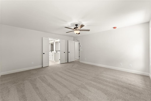 418 Brookstone Trl, Dawsonville, GA 30534 - unfurnished bedroom with light carpet, baseboards, a ceiling fan, and connected bathroom