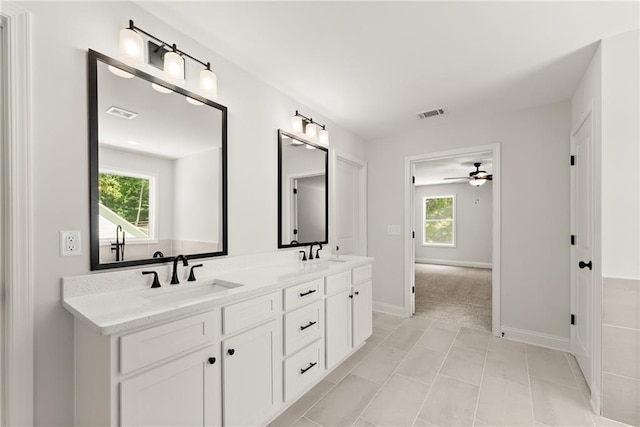 418 Brookstone Trl, Dawsonville, GA 30534 - full bathroom with double vanity, a ceiling fan, healthy amount of natural light, and baseboards