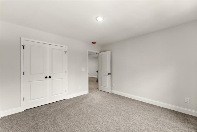 418 Brookstone Trl, Dawsonville, GA 30534 - unfurnished bedroom featuring carpet floors, a closet, and baseboards