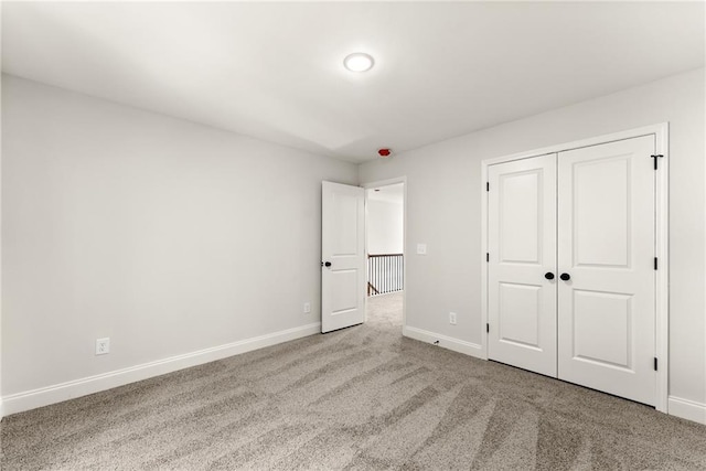 418 Brookstone Trl, Dawsonville, GA 30534 - unfurnished bedroom featuring carpet floors, baseboards, and a closet