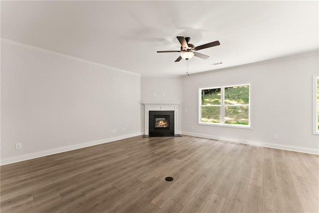 418 Brookstone Trl, Dawsonville, GA 30534 - unfurnished living room with a ceiling fan, wood finished floors, a fireplace with flush hearth, baseboards, and ornamental molding