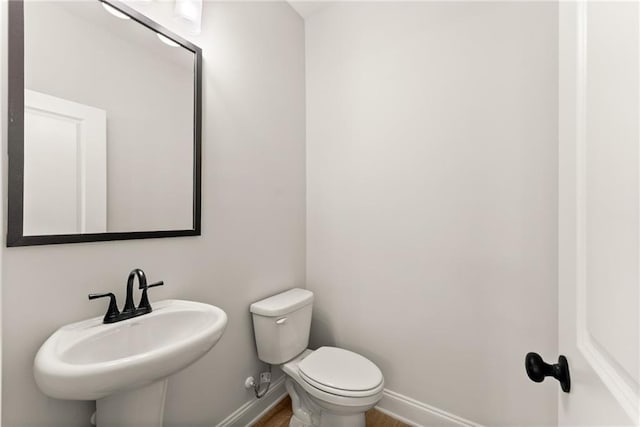 418 Brookstone Trl, Dawsonville, GA 30534 - half bath with baseboards, toilet, a sink, and wood finished floors
