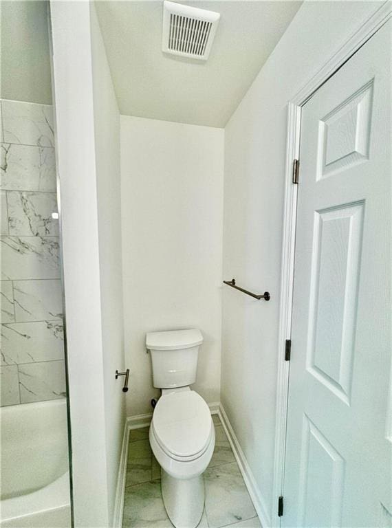 bathroom featuring toilet