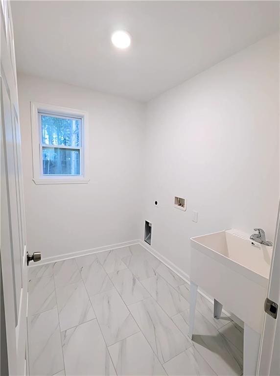 laundry room featuring washer hookup and sink