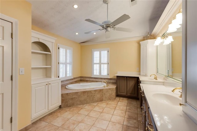 bathroom with tile patterned flooring, built in shelves, a garden tub, double vanity, and a sink