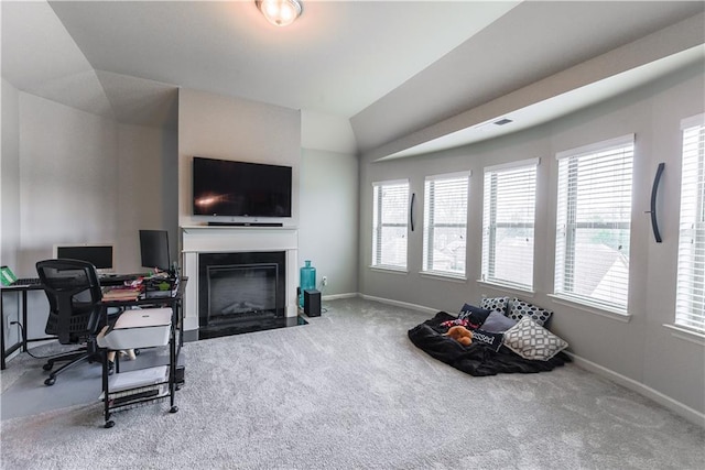 home office featuring carpet floors, plenty of natural light, and vaulted ceiling