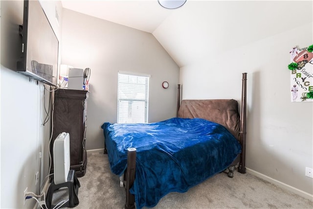 bedroom with light carpet and lofted ceiling