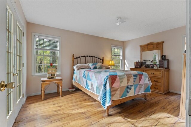 bedroom with light hardwood / wood-style flooring