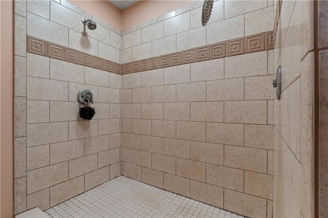 bathroom with a tile shower