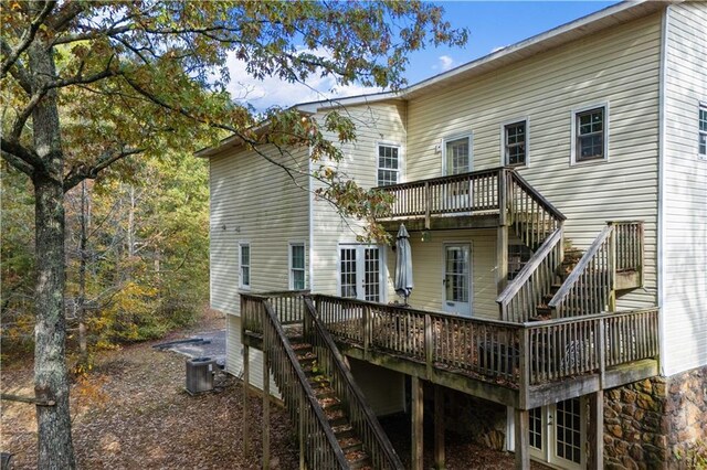 rear view of house with a wooden deck