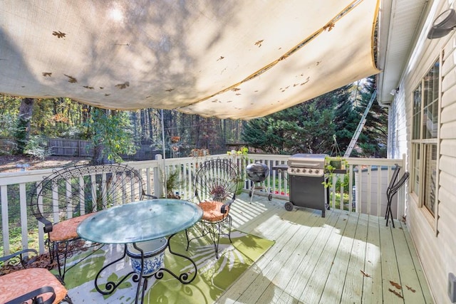 wooden deck featuring grilling area