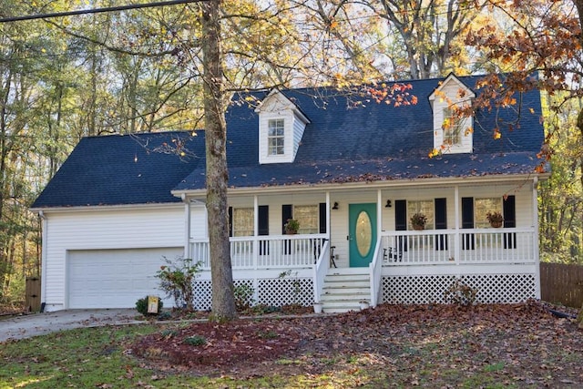 cape cod house with a porch and a garage