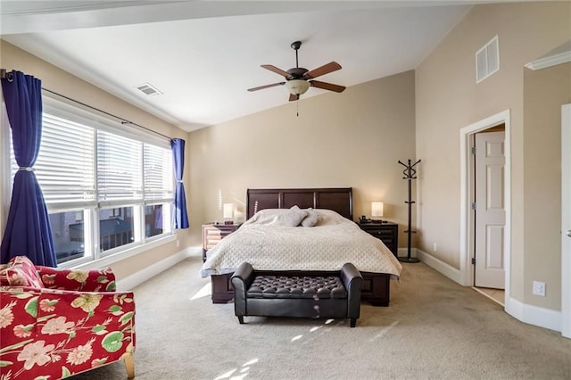 carpeted bedroom with ceiling fan and lofted ceiling